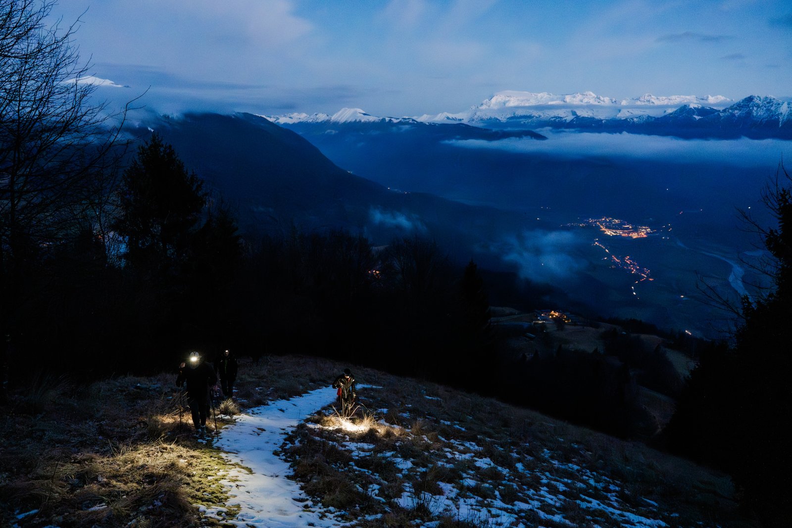 Group hiking by headlamp through the night on Forge48